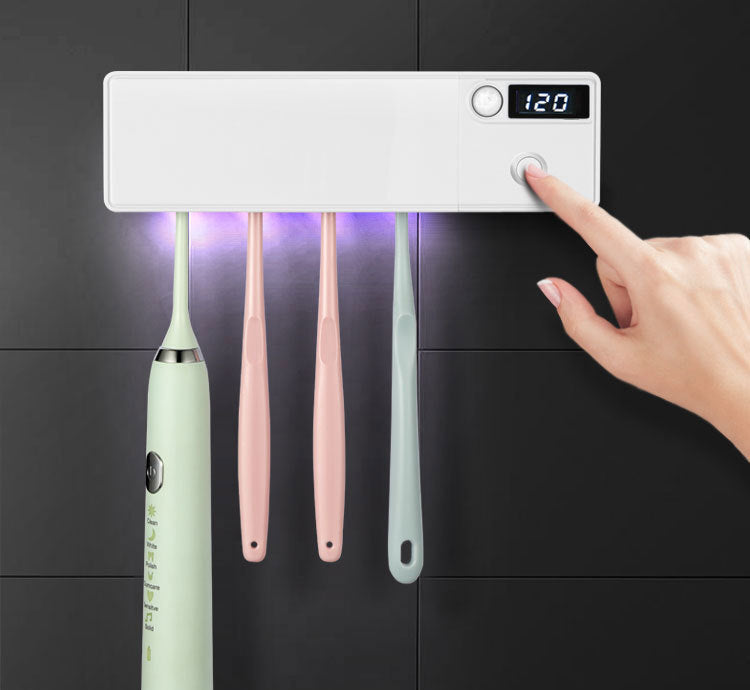 Toothbrush disinfector with UV light